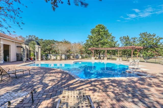 view of pool featuring a pergola and a patio