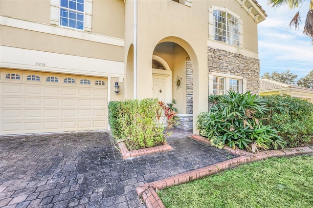 view of exterior entry featuring a garage