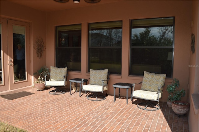 view of patio featuring ceiling fan