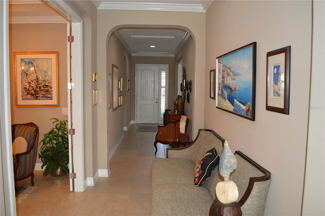 corridor with light tile patterned flooring and ornamental molding