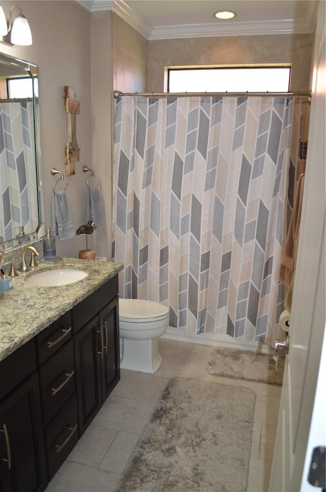 bathroom featuring tile patterned floors, vanity, toilet, walk in shower, and crown molding