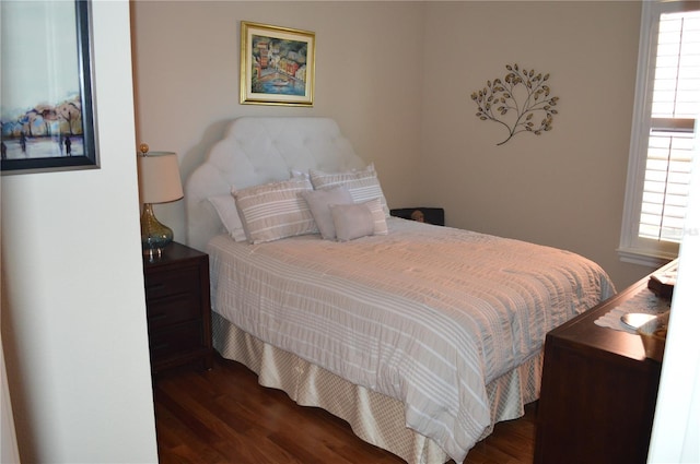 bedroom featuring dark wood-type flooring