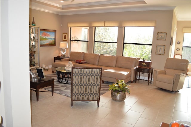 tiled living room with a raised ceiling and crown molding