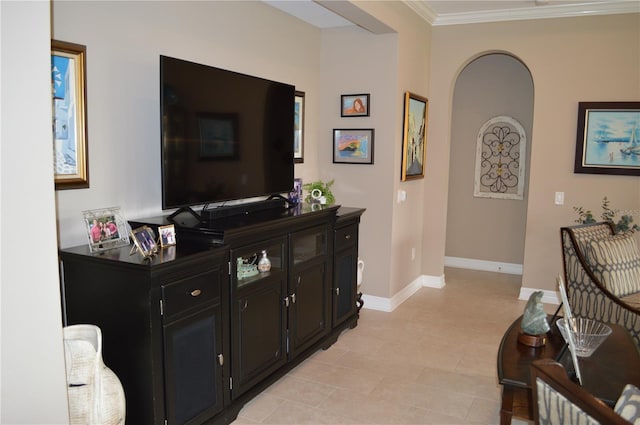 corridor featuring light tile patterned floors and ornamental molding