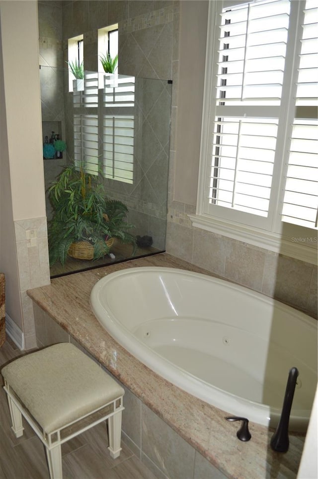 bathroom with tiled tub