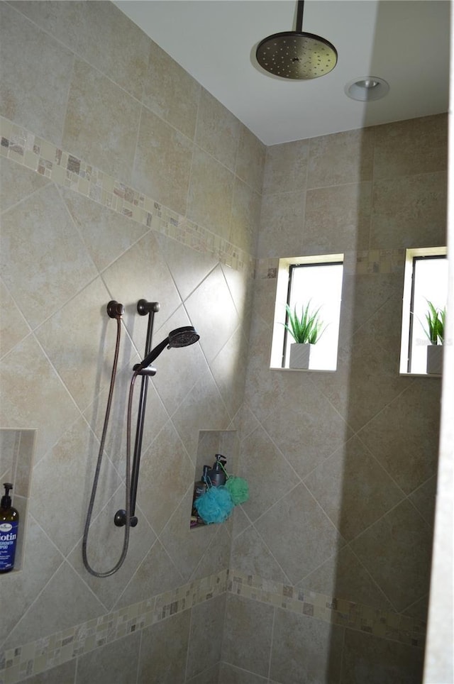 bathroom with a tile shower