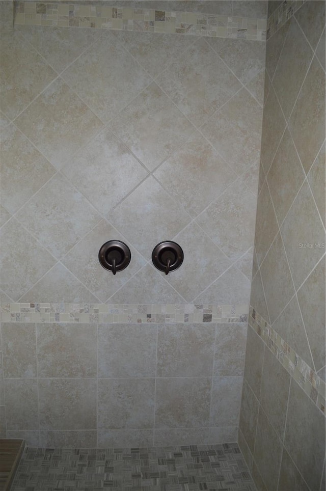 room details with a tile shower