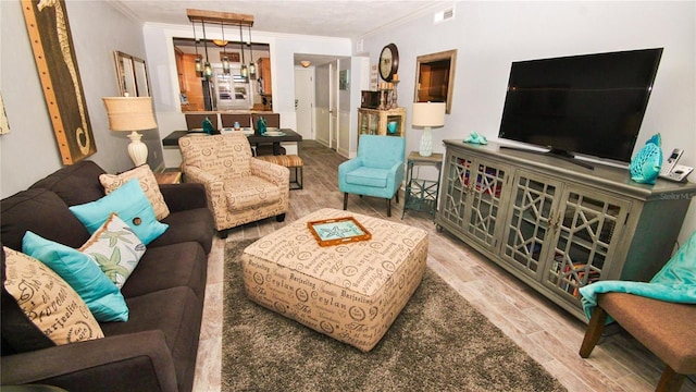 living room featuring crown molding