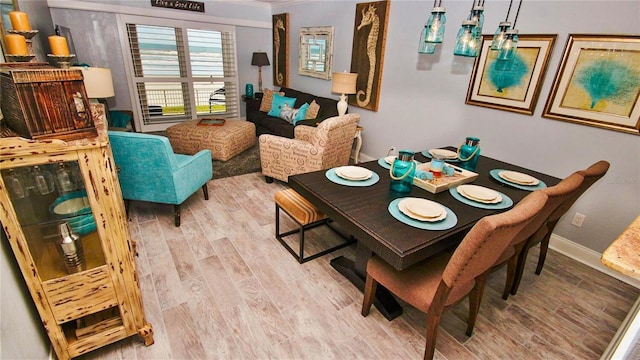 dining area featuring wood-type flooring