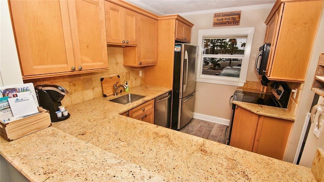 kitchen with stainless steel appliances, sink, hardwood / wood-style flooring, light stone counters, and crown molding