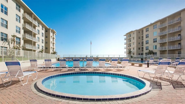 view of pool featuring a patio area