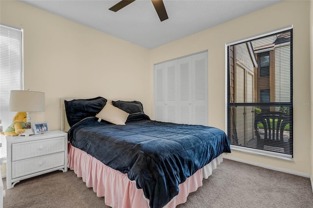 bedroom with ceiling fan, a closet, and carpet floors