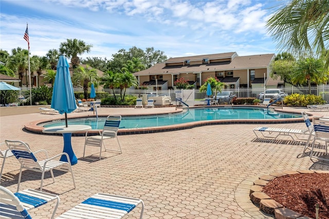 view of swimming pool with a patio area and a jacuzzi