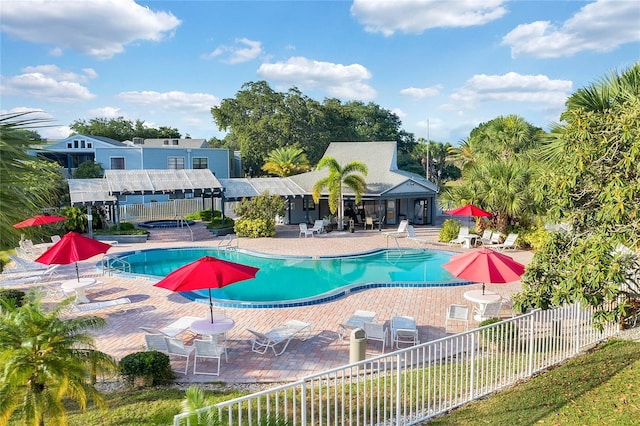 view of pool with a pergola and a patio area