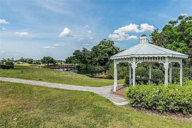 view of home's community featuring a gazebo, a yard, and a water view