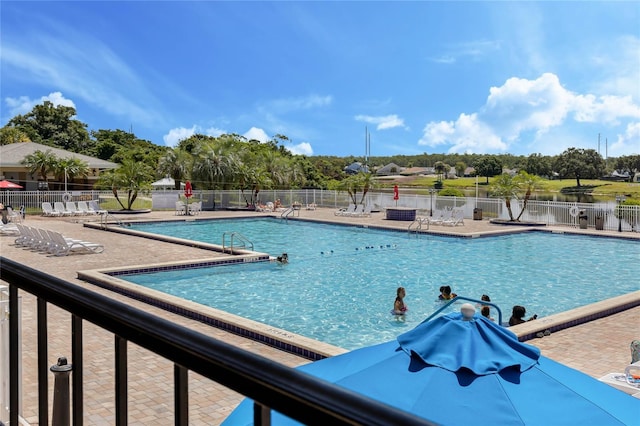 view of swimming pool featuring a patio area