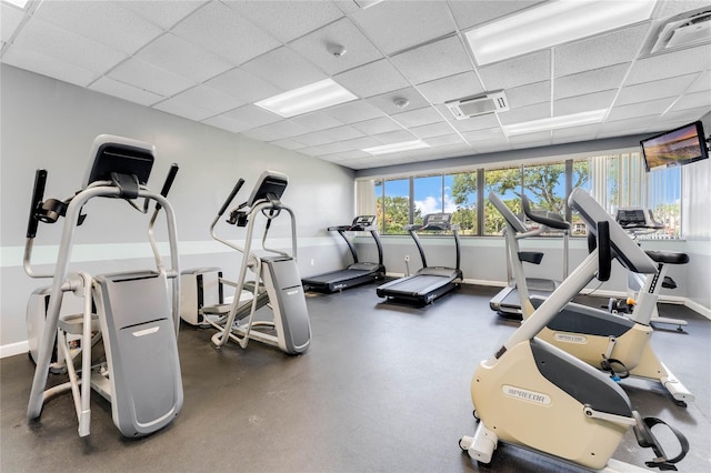 exercise room featuring a drop ceiling