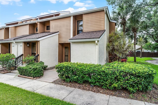 2923 Marshfield Ct Unit Ge, Orlando, FL 32822 - view of front of home with stucco siding and roof with shingles