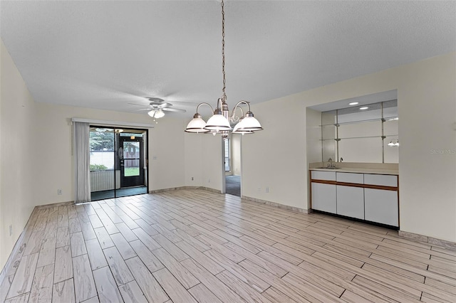 2923 Marshfield Ct Unit Ge, Orlando, FL 32822 - empty room with a sink, light wood-type flooring, a chandelier, baseboards, and a ceiling fan