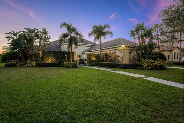 view of front of home with a yard