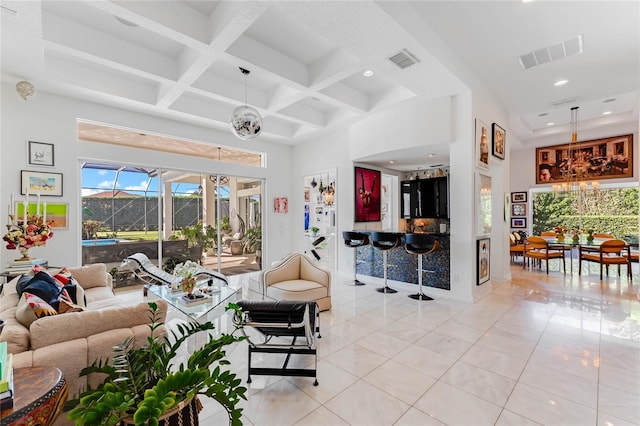 tiled living room featuring a chandelier, a towering ceiling, beamed ceiling, and coffered ceiling