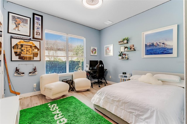 bedroom featuring hardwood / wood-style flooring