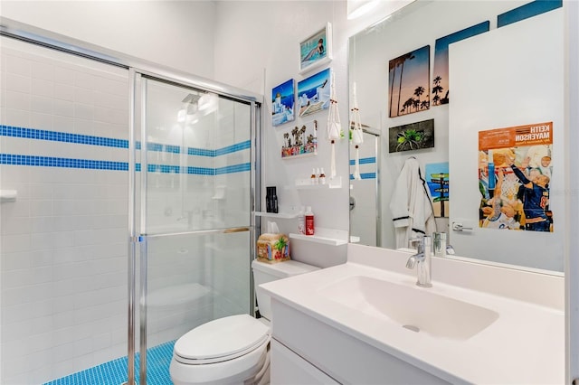 bathroom featuring toilet, an enclosed shower, and vanity