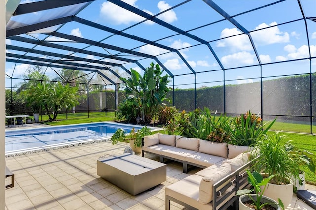 view of swimming pool featuring glass enclosure, a patio area, and an outdoor living space