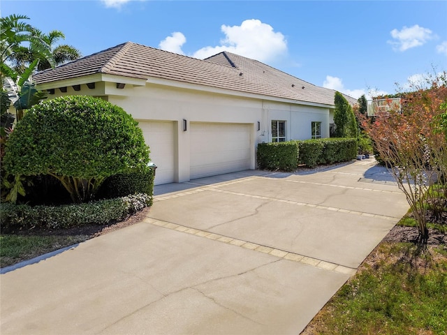 view of side of property with a garage