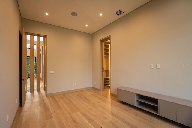 spare room with light hardwood / wood-style flooring