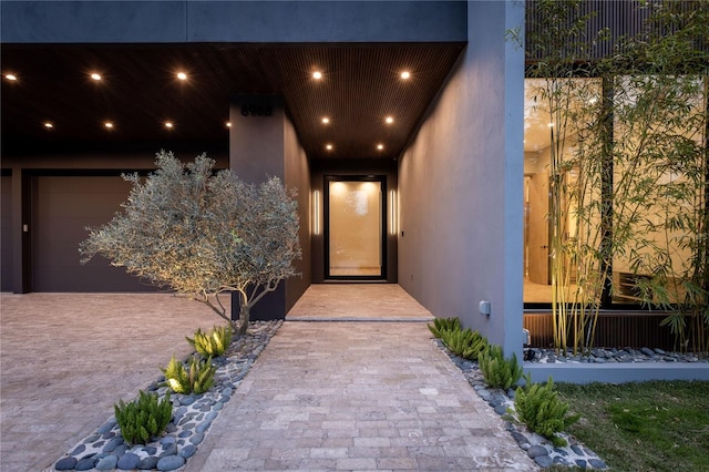 exterior entry at twilight with a garage