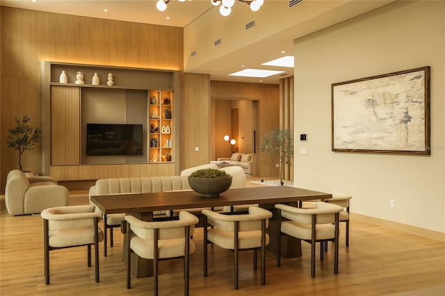 interior space featuring wood walls and light wood-type flooring