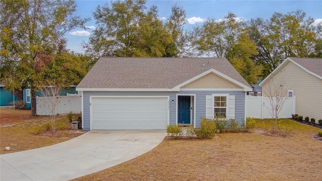 view of front of property with a garage and a front yard