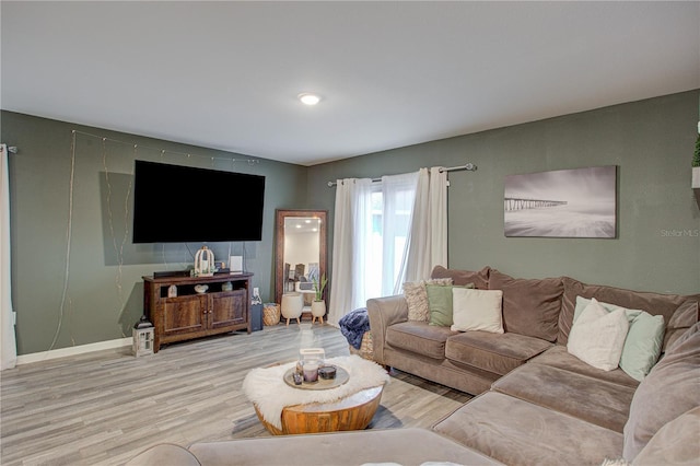 living room with light hardwood / wood-style flooring