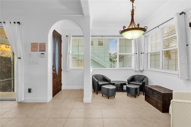 living area featuring a healthy amount of sunlight and light tile patterned floors