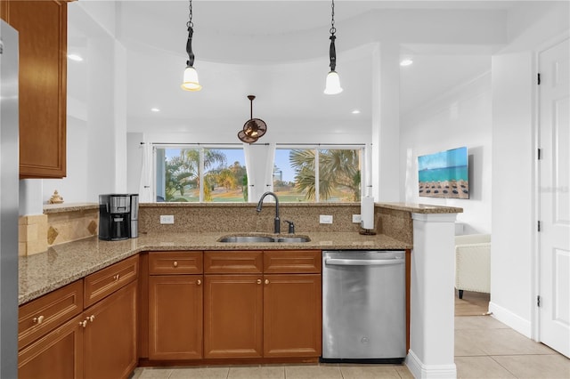 kitchen with sink, hanging light fixtures, kitchen peninsula, dishwasher, and light stone countertops