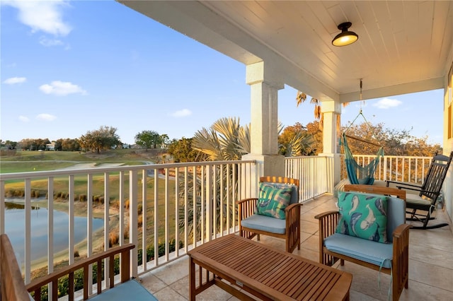 balcony featuring a water view