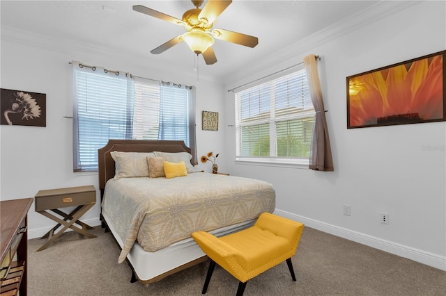 bedroom with crown molding, ceiling fan, and carpet flooring