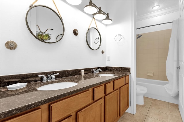 full bathroom featuring shower / bath combination with curtain, tile patterned flooring, ornamental molding, vanity, and toilet