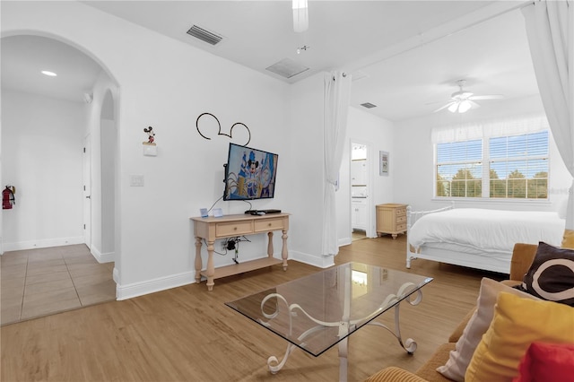 bedroom with hardwood / wood-style flooring and ceiling fan