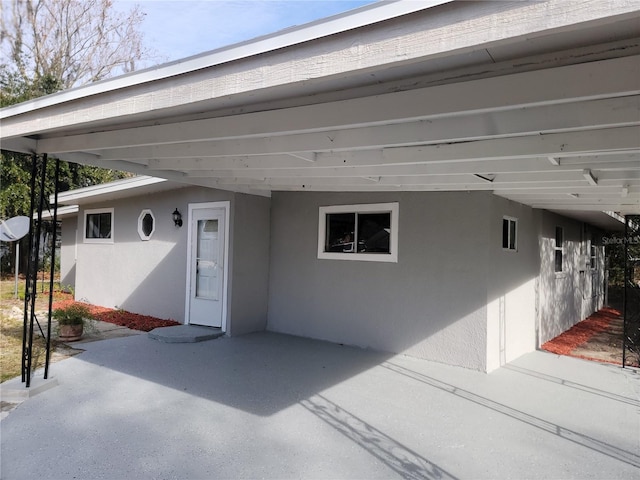 exterior space featuring a carport