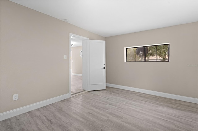 unfurnished room featuring light wood-type flooring