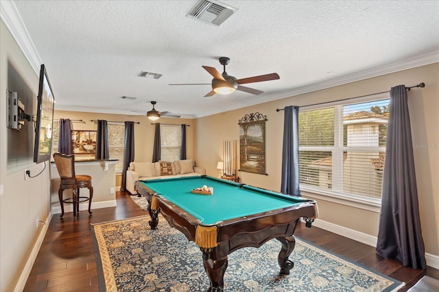 game room with a textured ceiling, billiards, dark hardwood / wood-style floors, ornamental molding, and ceiling fan