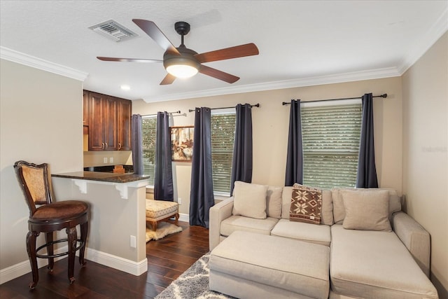 living room with ceiling fan, dark hardwood / wood-style floors, and crown molding