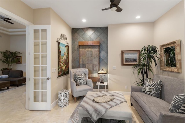 living area featuring ceiling fan, ornamental molding, and french doors