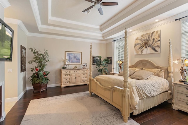 bedroom featuring dark wood-type flooring, ceiling fan, and multiple windows