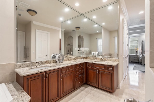 bathroom with vanity and crown molding