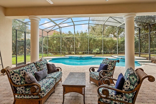 view of swimming pool featuring an in ground hot tub, a lanai, an outdoor living space, and a patio area