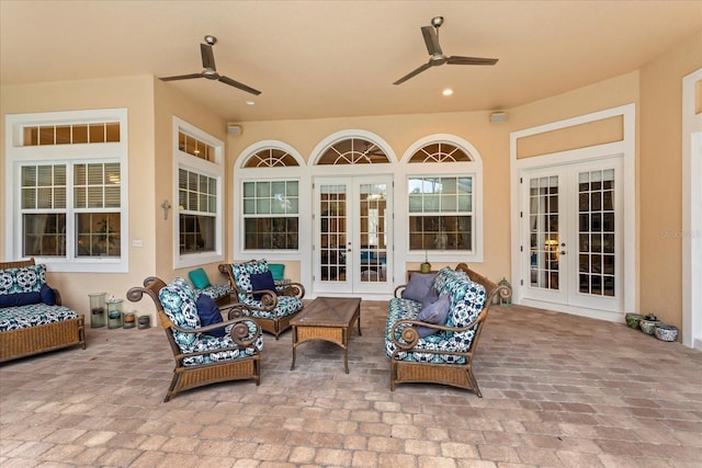 view of patio featuring ceiling fan, an outdoor hangout area, and french doors