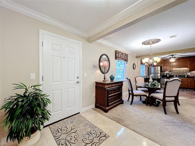 carpeted dining space featuring a textured ceiling, a chandelier, and crown molding